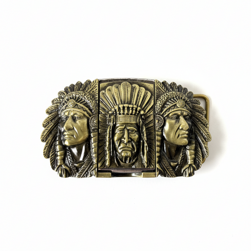 Bronze belt buckle with three Native American head designs on a white background